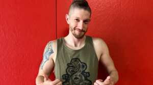a man with tattoos on his arm